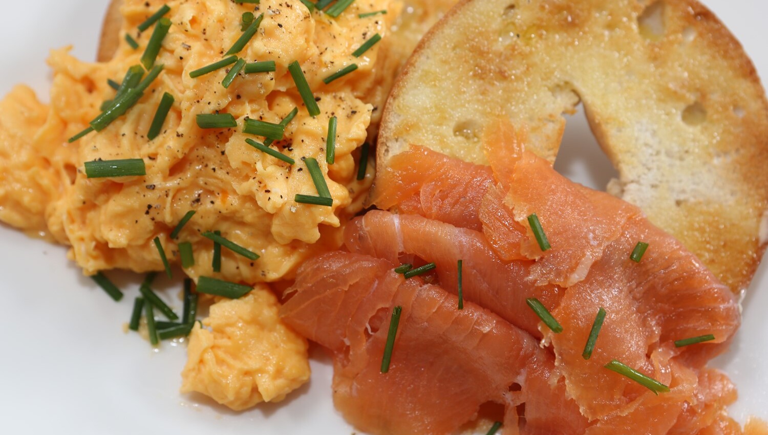 Smoked salmon & scrambled eggs (loacally laid) on toasted bagel